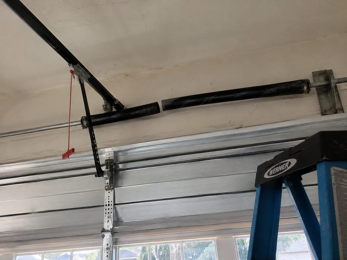 Broken torsion spring above a garage door